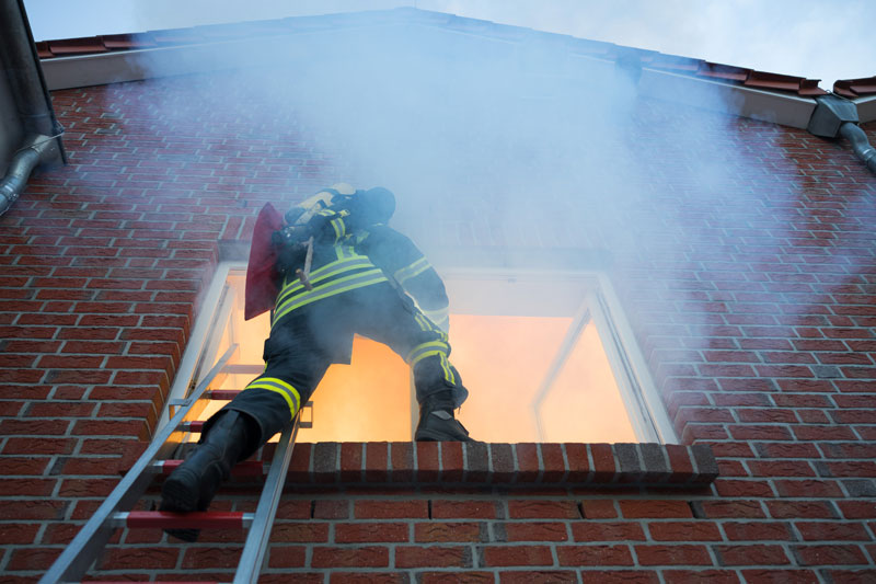 firefighters-at-the-window-of-house